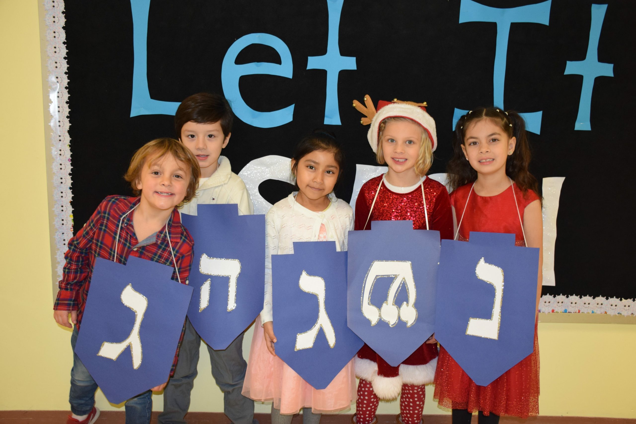 Hampton Bays Elementary School first-graders celebrated “Holidays Around the World,” a festive annual production staged for family and friends on December 13. Dressed in colorful holiday outfits, each class stood to recite facts and poems about the various holidays they had studied in class. They also entertained the audience by singing holiday songs.