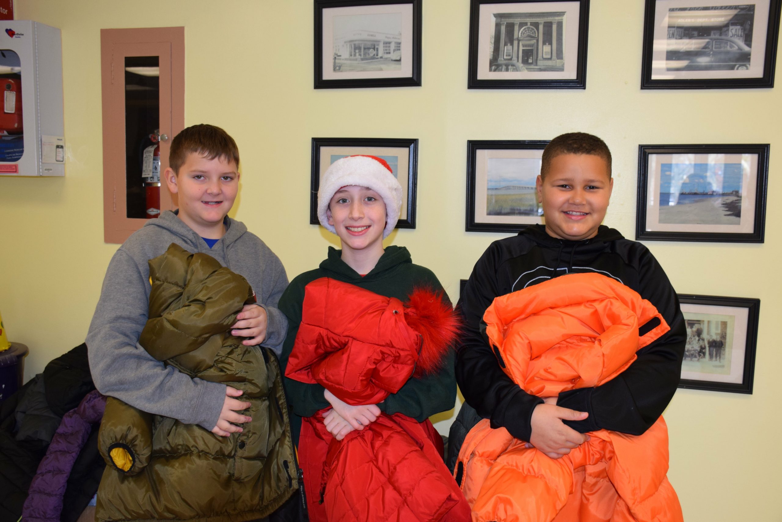 To give back to the community, members of the Hampton Bays Elementary School K-Kids community service club recently organized a coat drive. All coats will be donated to local families in need. From left,  K-Kids Liam Fitzgerald, Sean Donahue and John Hayes.