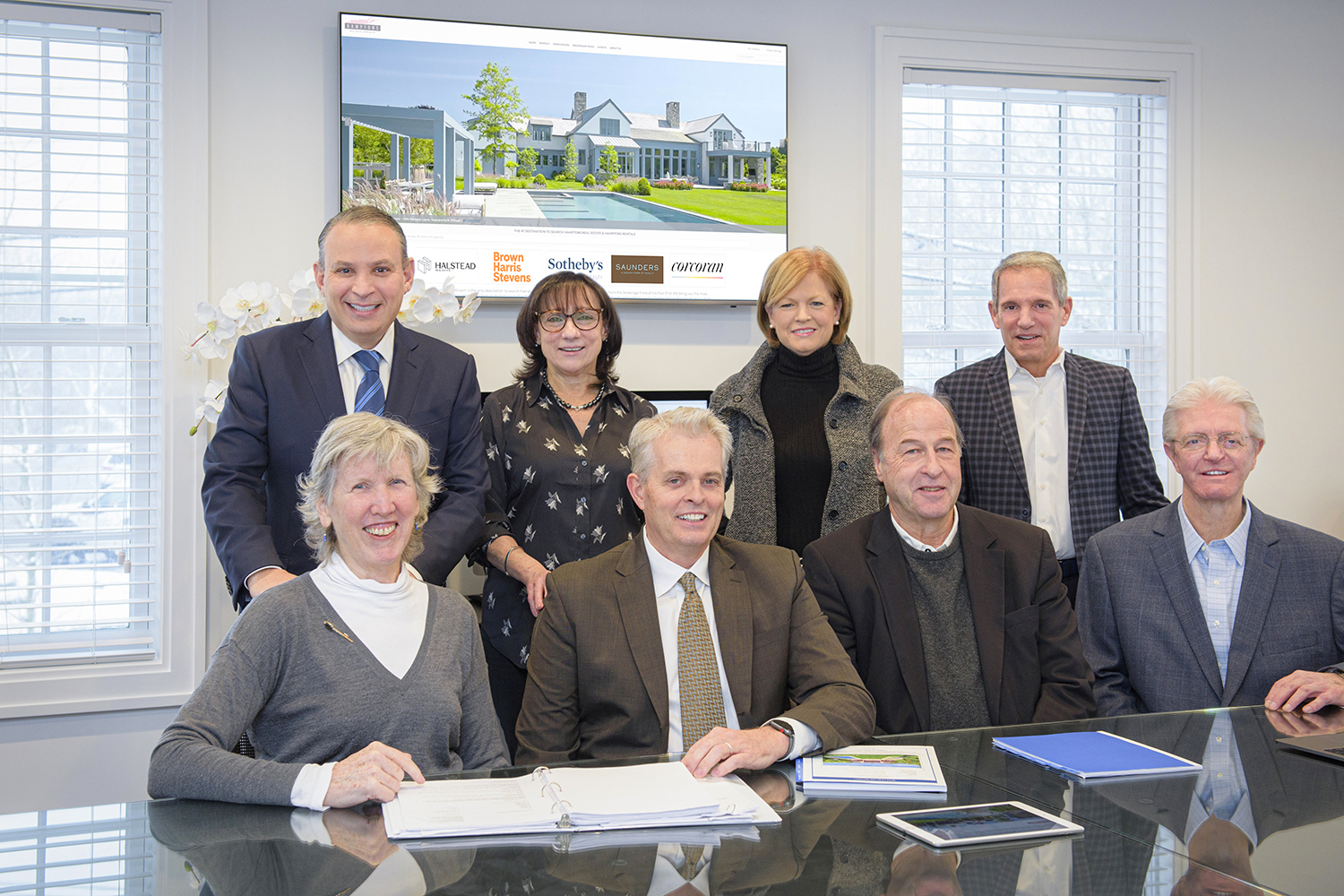 The Hamptons Real Estate Association Board, from left, seated, Andrew Saunders (Saunders & Associates), Cia Comnas (Brown Harris Stevens), Nanette Hansen (Sothebys), Ernie Cervi (Corcoran), standing, Theresa Quigley (Saunders & Associates), Robert Nelson (Brown Harris Stevens), Ed Reale (Sothebys), Marty Gleason (Corcoran).