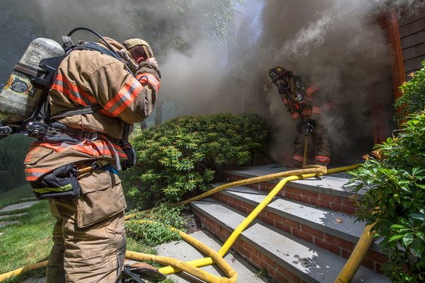 Firefighters battle a blaze started by a dryer at a Merchants Path residence