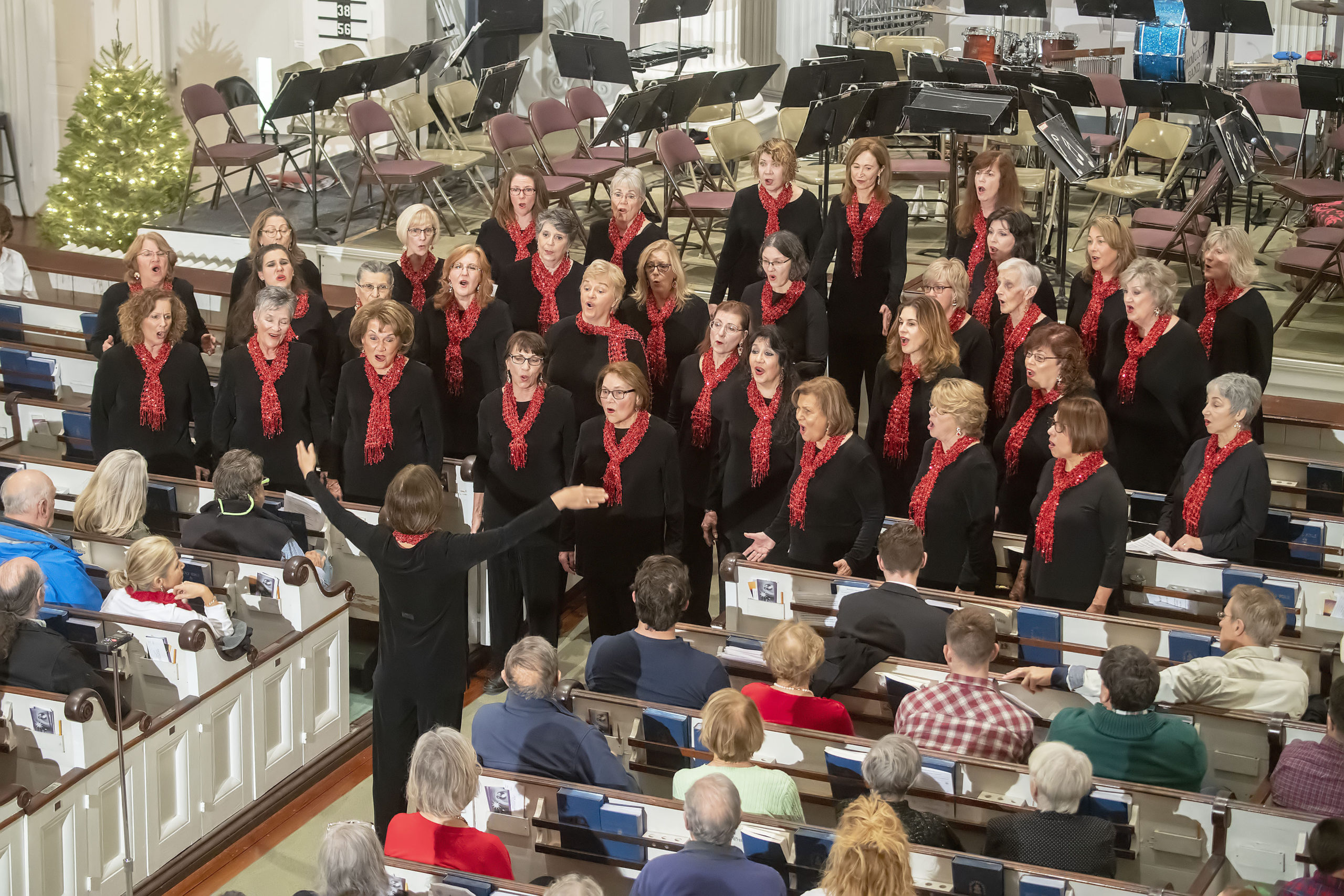 Assistant Music Director Linda Gorniok leads the Long Island Sound Chorus of Sweet Adelines International during the Annual Holiday Concert at the First Presbyterian 