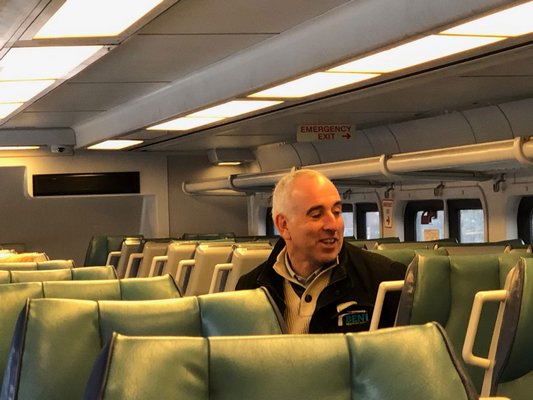 Southampton Town Supervisor Jay Schneiderman rides the South Fork Commuter Connection on Monday morning. JOE SHAW