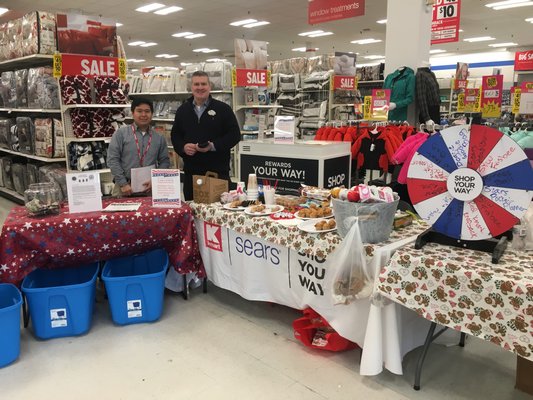 Alberto DeJesus and Richard Tutching, Kmart employees, held a fundraiser for the United States Coast Guard on Sunday at Kmart. ELIZABETH VESPE