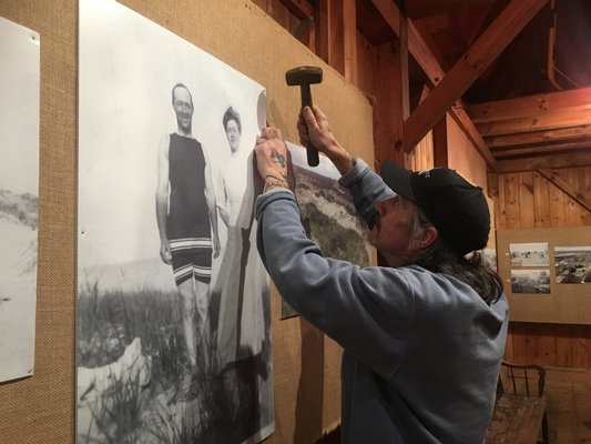 Dell Cullum readying the exhibit on Thursday