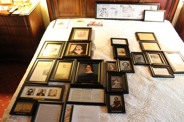 Cindy Burnham is bringing her family’s large collection of photographs and documents that trace back seven generations to Rogers Memerial Library.   JULIA HALSEY