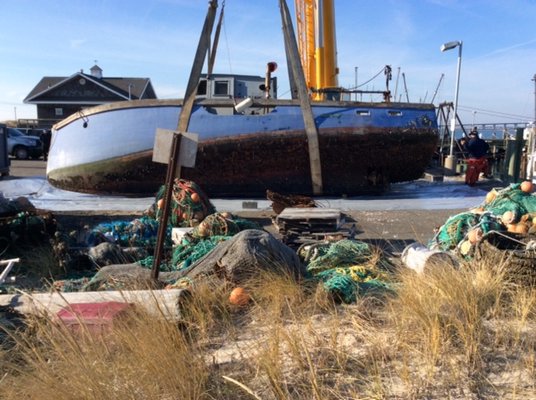 A sinking 40-foot fishing vessel was pulled from the Shinnecock commercial fishing docks on December 23. COURTESY OF SOUTHAMPTON TOWN