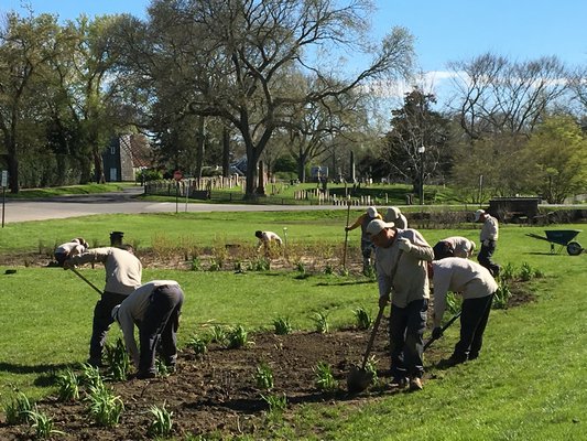 Workers planted a demonstration garden on the village green in East Hampton this week. KYRIL BROMLEY