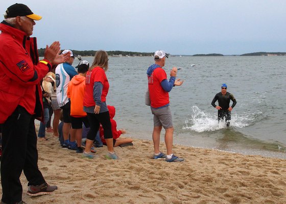 Triathletes braved cool air temperatures and tough surf conditions at the Mighty Hamptons Triathlon on Sunday morning. KYRIL BROMLEY