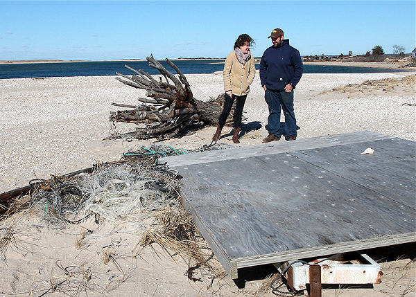 East Hampton Town Trustees  Deborah Klughers and Nat Miller with detritus at Lazy Point that needs to be cleaned up. KYRIL BROMLEY