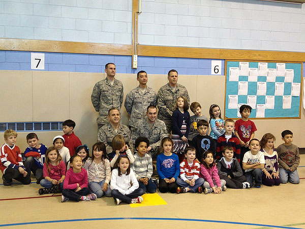 Members of the Air National Guard 106th Rescue Wing with first grade students at the Remsenburg-Speonk Elementary School. CAROL MORAN
