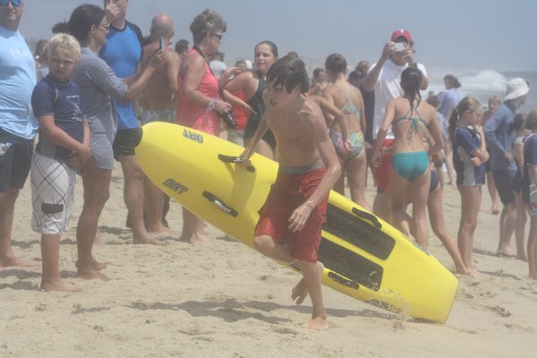 Junior lifeguards in action in the landline rescue on Saturday. CAILIN RILEY