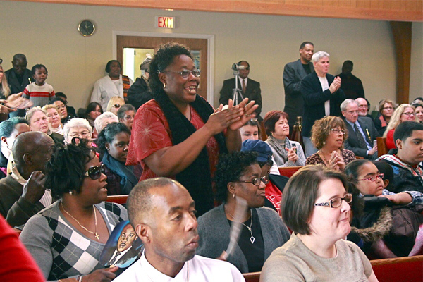 Members of the Calvary Baptist Church youth group sing along to the opening hymn.