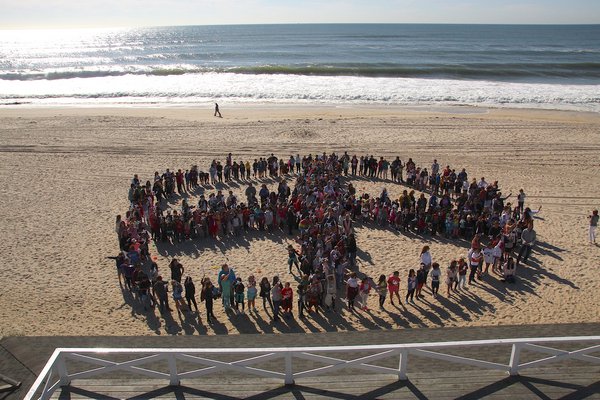 Students from John Marshall Elementary School gathered at Main Beach on Friday to participate in the international Pinwheels for Peace effort. Marking the International Day of Peace on Saturday, the event uses pinwheels because its a symbol of a gentler, more joyful time, childhood. KYRIL BROMLEY