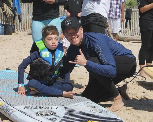 Ryder Mesnick with instructor Adam Williams  at the Walk on the Water event at Ditch Plains on Friday.