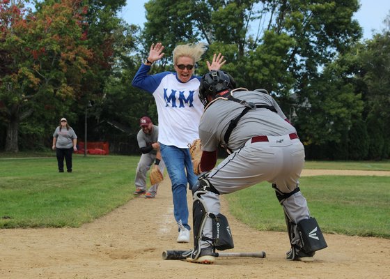 Recreating a 100-year-old local tradition, the Maidstone Mugwumps (a team comprised of Maidstone Club members and family) did battle on the baseball diamond with The Bonac Native Sons and Daughters on Sunday at Herrick Park. Hugh King was the emcee/play-by-play announcer. The game was a fundraiser sponsored by the East Hampton Historical Farm Museum. The game ended with the Bonackers victorious, 4-3, having cut down the potential tying run at the plate to end the game