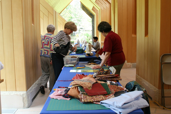 A group of women quilts for the wheelchair-bound on the first Tuesday of every month at the Jewish Center of the Hamptons. 