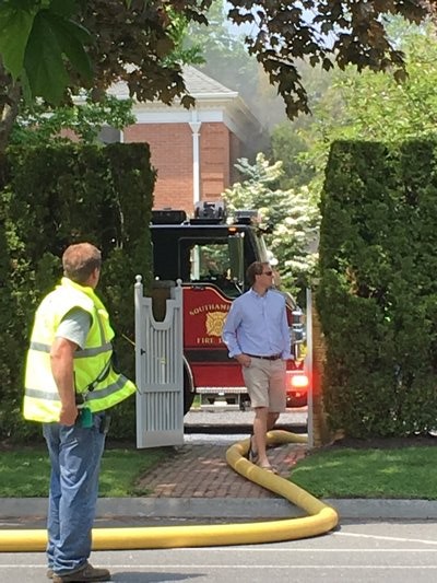 Fire departments responded to a basement structure fire on First Neck Lane in Southampton Village on Friday. DANA SHAW
