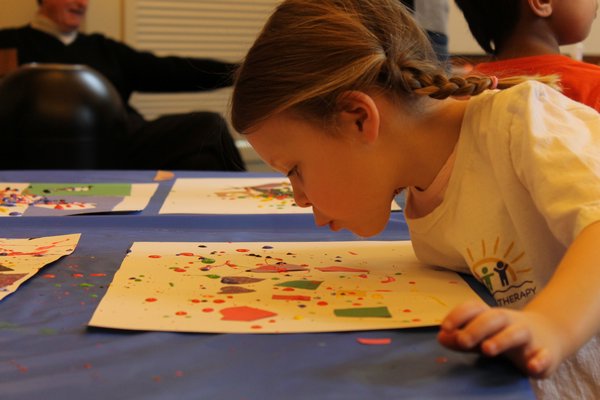Children ages 3 and older learned about Jackson Pollock on Saturday morning in the Quogue Library then attempted to imitate his painting style. KYLE CAMPBELL