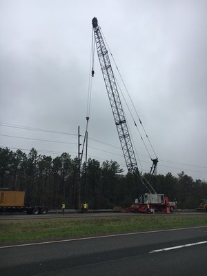 PSEG contractors are installing nealry 150 new electric poles along County Road 51 between Riverhead and Eastport