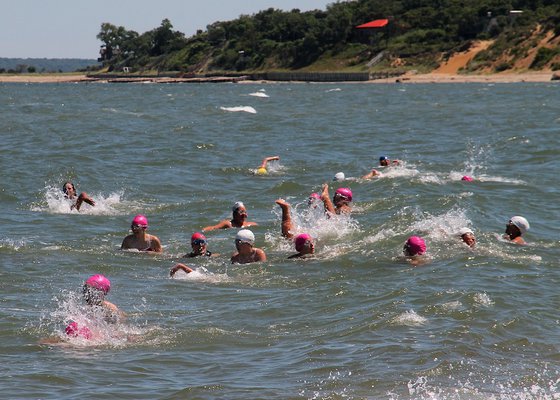 Members of the i-tri triathalon group train with the West Neck Pod open-swim group at the Maidstone Park in Springs. KYRIL BROMLEY
