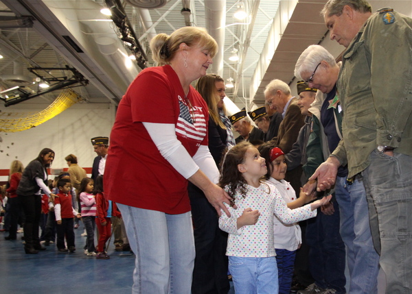 John Marshall Elementary School students shook the hands of veterans at a ceremony in their honor on Friday. 