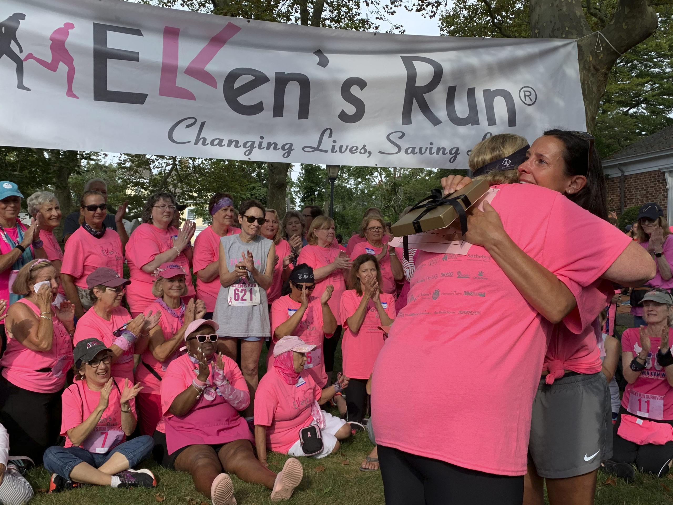 Sweat And Tears 
August 22 -- Dawn Moore of Hampton Bays receives the “Golden Acorn” before this year's Ellen’s Run. The award is given to one breast cancer survivor each year.
