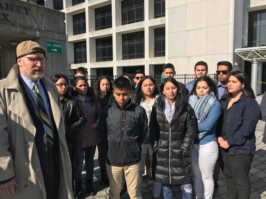 Attorney Daniel Rodgers with family and friends of Bryan Siranaula outside of Suffolk County Criminal Court in February.   PRESS FILE