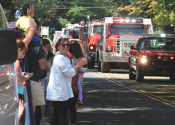 Members of the Amagansett Fire Department's Ladies Auxiliary march in Saturday's parade. KYRIL BROMLEY