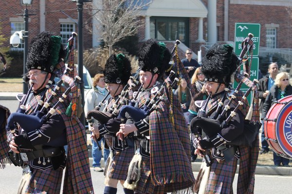 Members of the International Brotherhood of Electrical Workers Local 25 Pipes and Drums band march in the annual Westhampton Beach St. Patrick's Day parade on Saturday afternoon. KYLE CAMPBELL