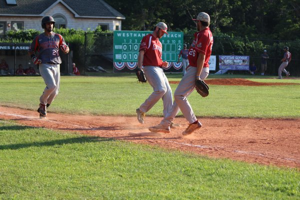 Kevin Podell (Molloy) steps on second and attempts to complete a double-play. LUKE DYER