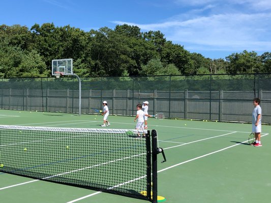 Children playing at the Ross School Tennis Academy.