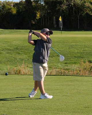 James Tomasini tees off at the first tee at The Woods on Thursday