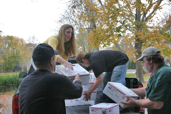 Michelle Severance hands over packages going to the post office that are meant for servicemen serving in Afghanistan. 