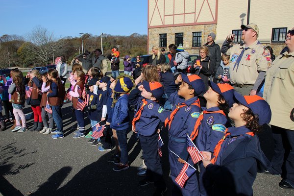 Boy Scouts and Girl Scouts took part in a flag ceremony observing Veterans Day on Monday at the Montauk Playhouse. Pat DeRosa