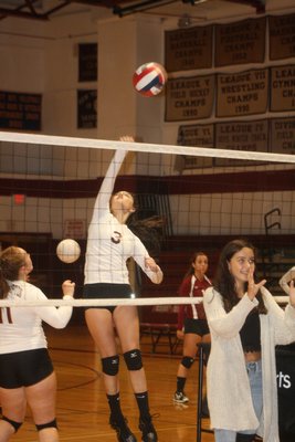East Hampton's Madyson Neff goes up for a hit in her team's warm-up before taking on Miller Place. CAILIN RILEY
