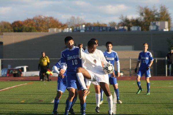 Esteban Valverde keeps his eye on the ball while being tracked by Glenn's Sean Urda. CAILIN RILEY