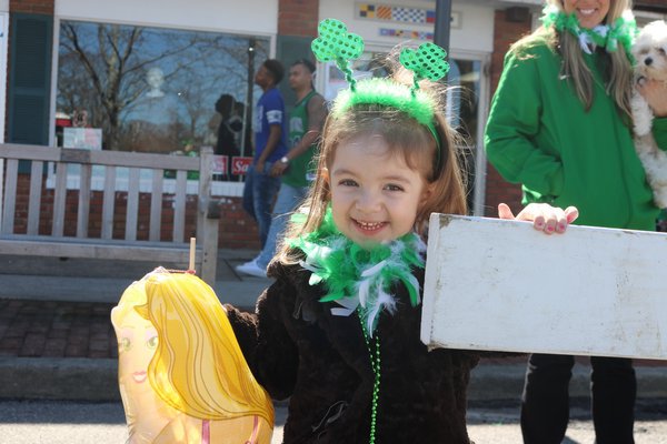  wait for the start of the annual Westhampton Beach St. Patrick's Day parade. ERIN MCKINLEY