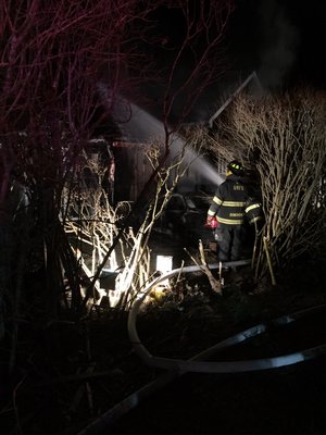 A vehicle crashed into a home on Hayground Road and burst into flames early Sunday morning.
