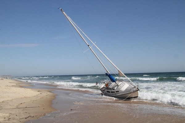 The sailboat Vanna White was pulled off the beach in Montauk on Thursday afternoon. Michael Wright