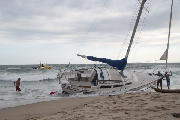 The sailboat Vanna White was pulled off the beach in Montauk on Thursday afternoon. Michael Wright