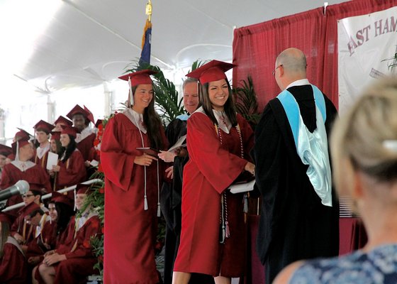 Students are awarded their diplomas.