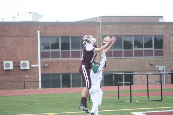 Aaron Kryzsewski tries to haul in a pass in the end zone. CAILIN RILEY