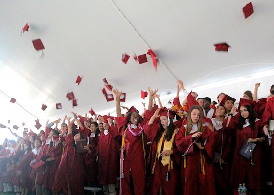 The Class of 2014 throw their mortor boards in the air.