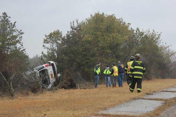 A car slipped on the ice and overturned on Speonk-Riverhead Road in Speonk just before noon on Friday. BY CAROL MORAN