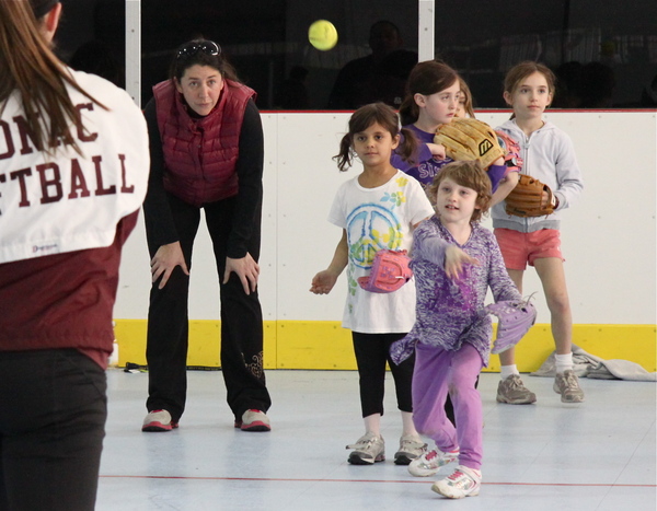 Sarah Morgan practices her throw at a Little League clinic at the Sportime arena in Amagansett on Sunday.
