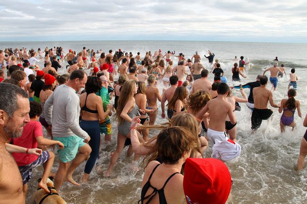 Hundreds took the plunge at Main Beach on Friday afternoon.