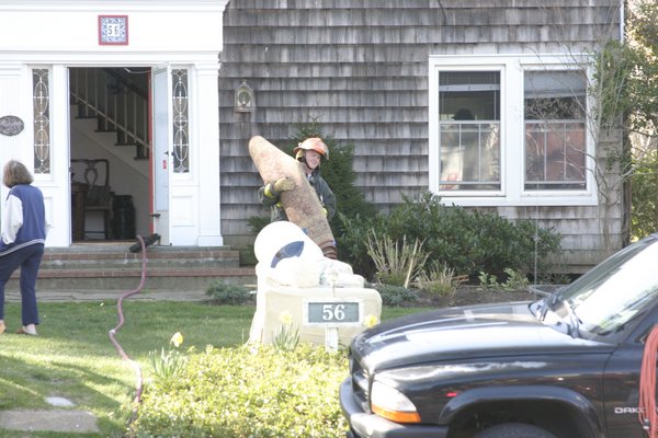 Firemen from East Hampton and Amagansett had to cut through the floors of an Accabonac Highway home on Saturday morning to douse an electrical fire that broke out in a crawl space. M. Wright