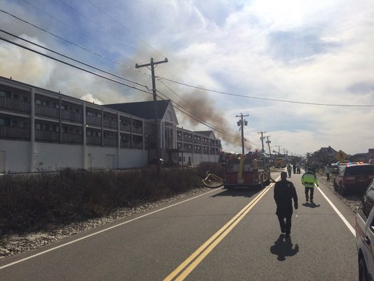 Firefighters battle a blaze in Westhampton Beach on Wednesday. KYLE CAMPBELL