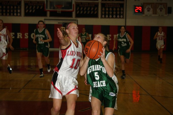 Kennedy Skala heads to the basket while Pierson's Kasey Gilbride defends. CAILIN RILEY