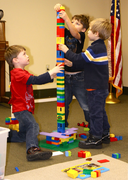 Adam and Owen Debackere and Charlie Troy collaborated on a tower at the Amagansett Library last Thursday. 